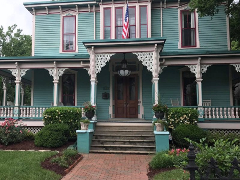 Victorian home with freshly painted porch and trim in the Charlotte area