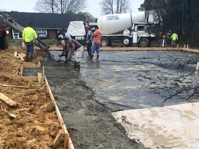 Concrete crew pouring a commercial slab