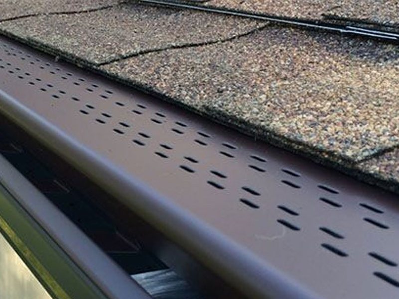Gutter guard installed on a roof edge